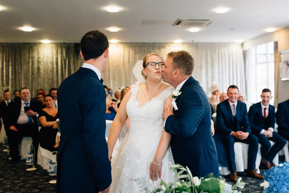 father of the bride giving her a Kidd during a wedding ceremony at Ribby Hall
