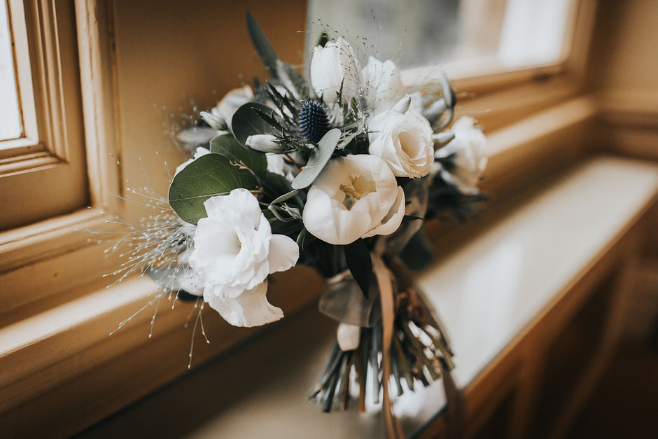 Bridal Bouquet with white roses, thistles and lots of foliage