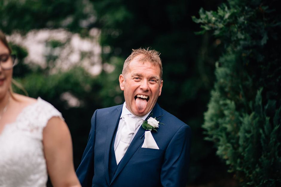 photograph of a man pulling his tongue out towards me