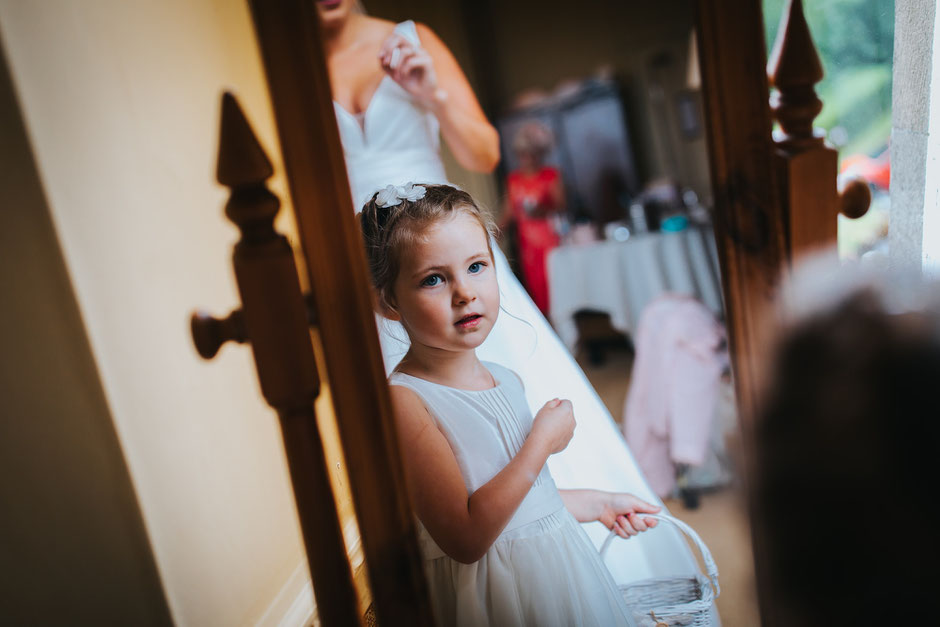 reflection of a flower girl at her aunties wedding