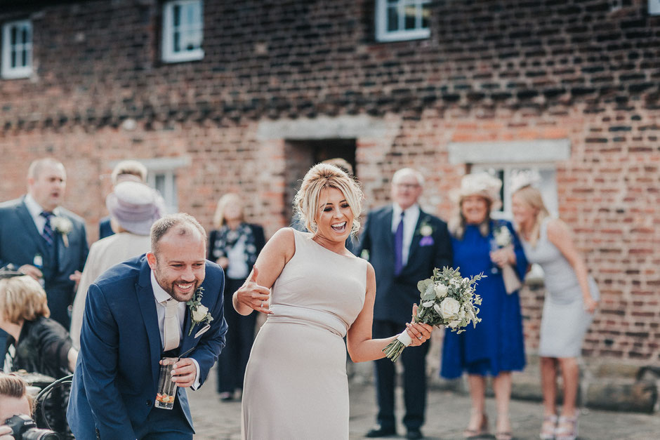 candid shot of wedding guests having fun and laughing