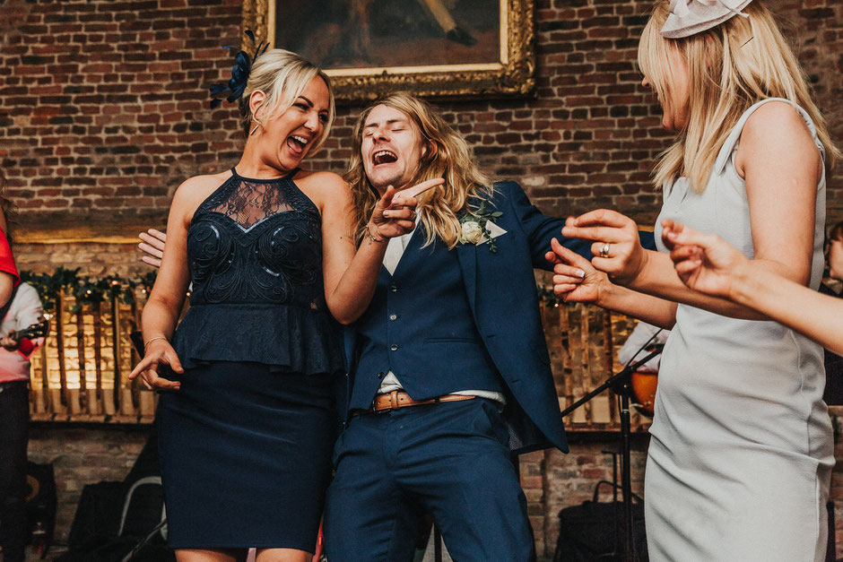 guests dancing during an evening wedding reception at meols hall