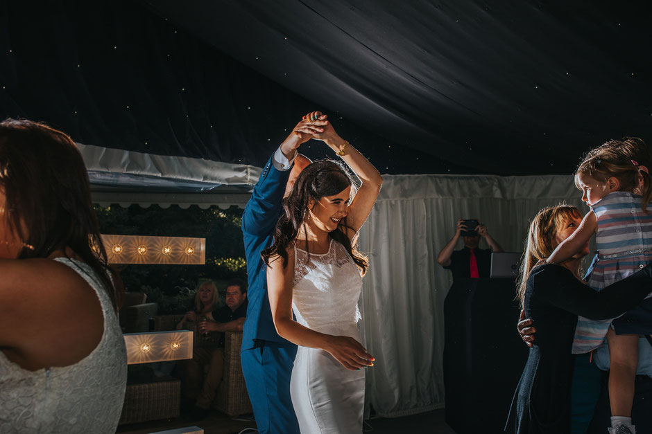 bride and groom dancing during their wedding reception