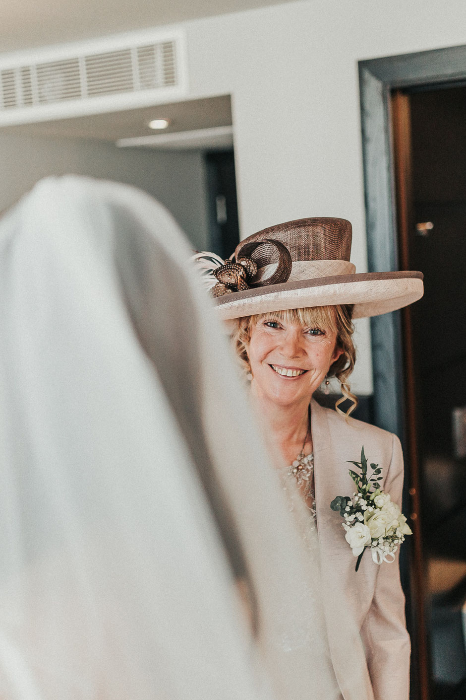 a portrait of the brides mother in a hat