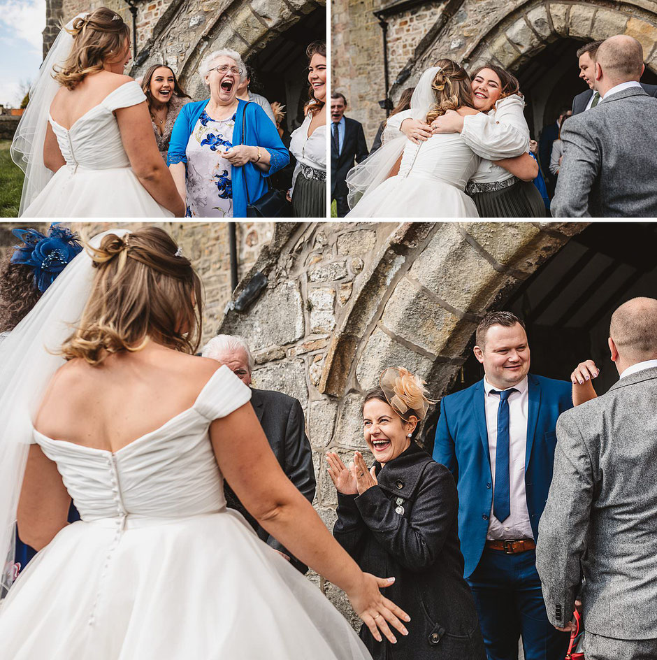 guests looking excited as they congratulation the newly married couple