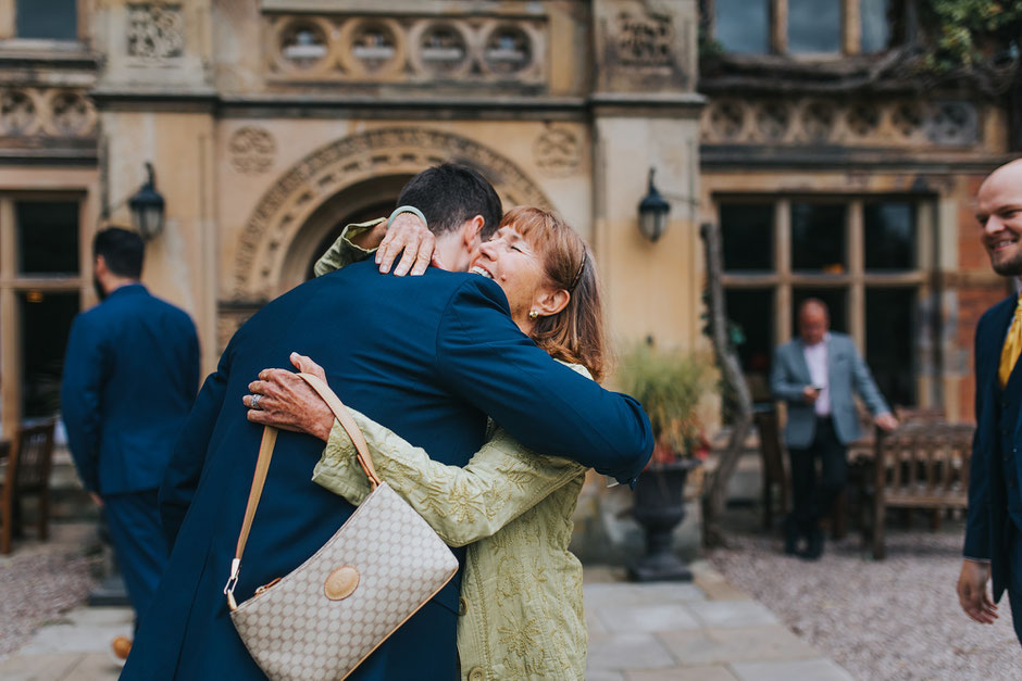 candid moment of two people hugging at soughton hall