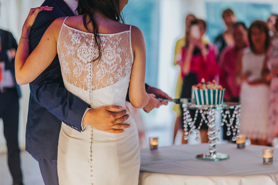 bride and groom cutting their wedding cake at soughton hall