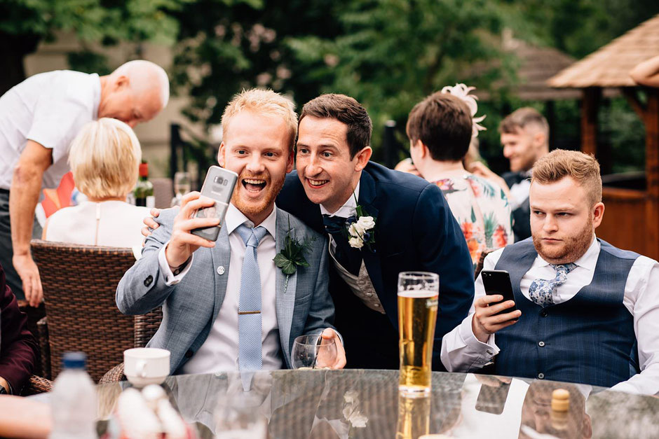 wedding guests posing for a selfie