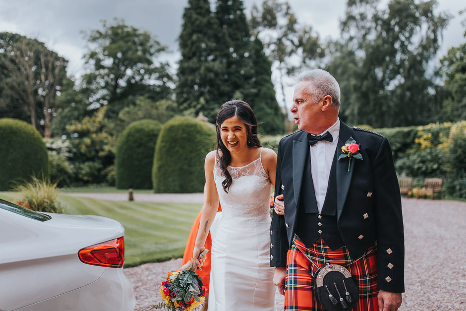 Bride & her father arriving at Soughton Hall for her wedding