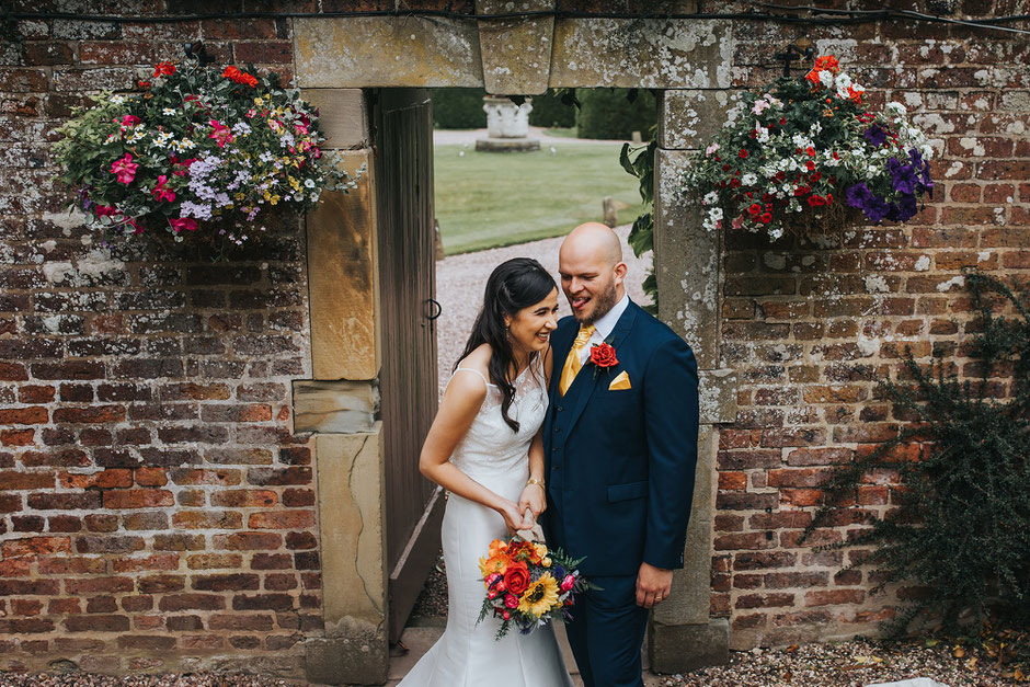 bride and groom laughing and being silly during portraits at soughton hall