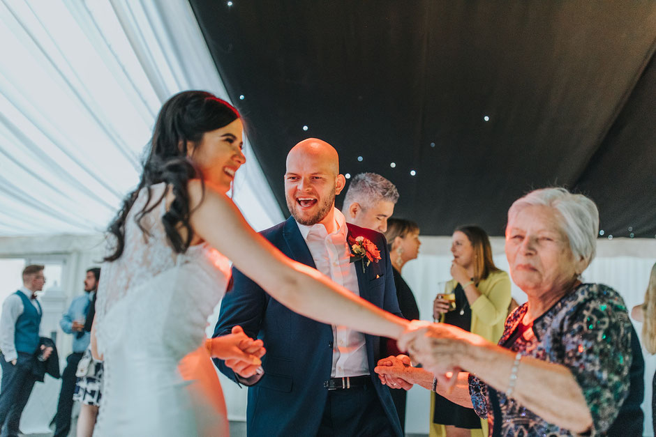 bride groom and grandma dancing at soughton hall