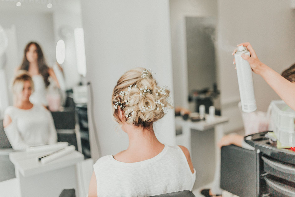 beautiful bridesmaids hair up do with fresh flowers