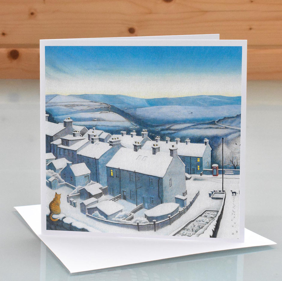 Christmas card winter scene featuring snow covered rooftops New Mills, Derbyshire Kinder Scout beyond