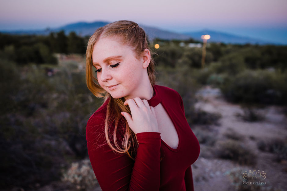 beautiful girl strawberry blonde hair and red dress senior session at sunset. Fleur de Lea Photography 