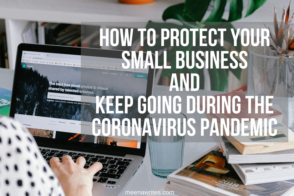 WOMAN TYPING ON LAPTOP AT HOME LOOKING AFTER BUSINESS DURING CORONAVIRUS PANDEMIC