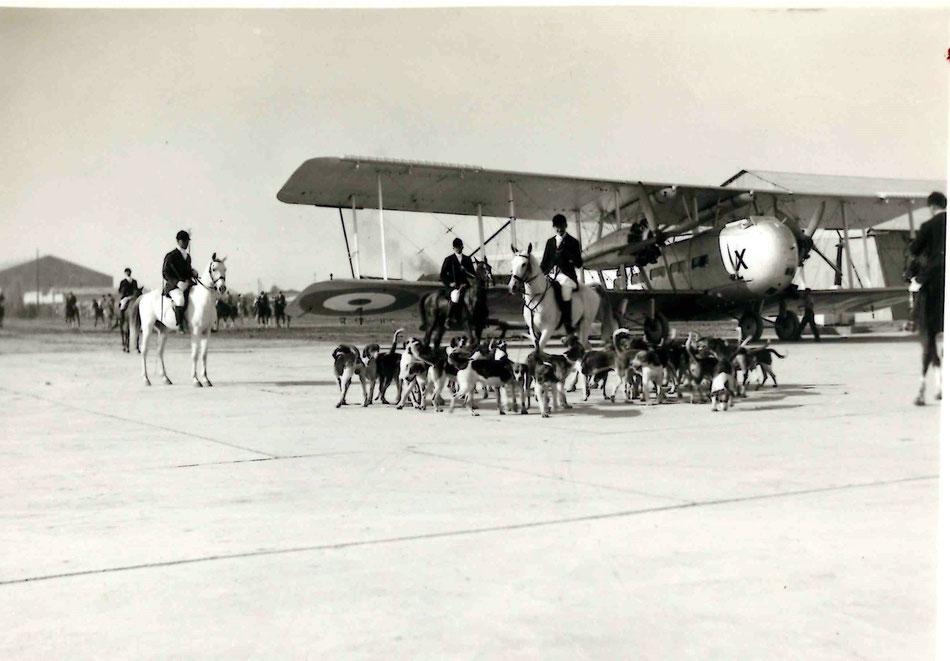 The "Royal Exodus" Hunt at Hinaidi - FO Oliver on Left.  The aircraft is a Vickers from 70 Squadron.  Jackals were hunted in the desert...