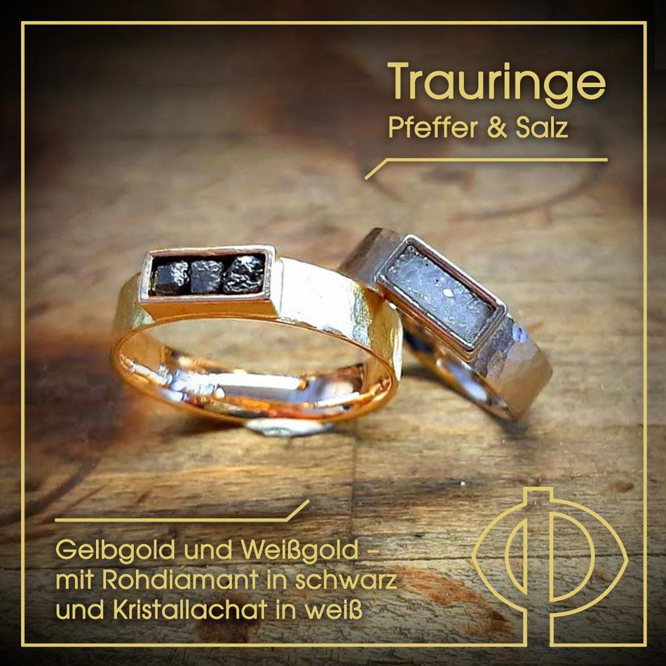 Handmade Trauringe aus Gelbgold und Weißgold; Rohdiamant in schwarz und Kristallachat in weiß – handgearbeitet in der Goldschmiede P. Oellerich in Bremerhaven