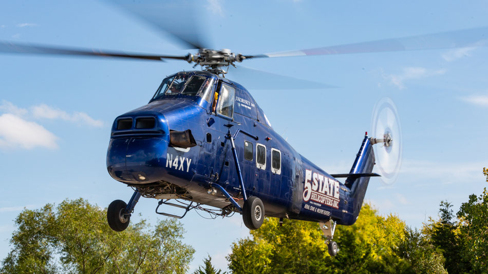 N4XY slowly landing on the small helipad. Still wearing the old colors and Logo, to be replaced with the same livery as the UH-60A Blackhawk.