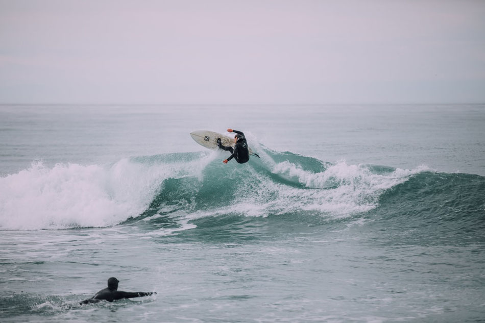 Surfing a Wave. Image: Tim Marshal via Unsplash