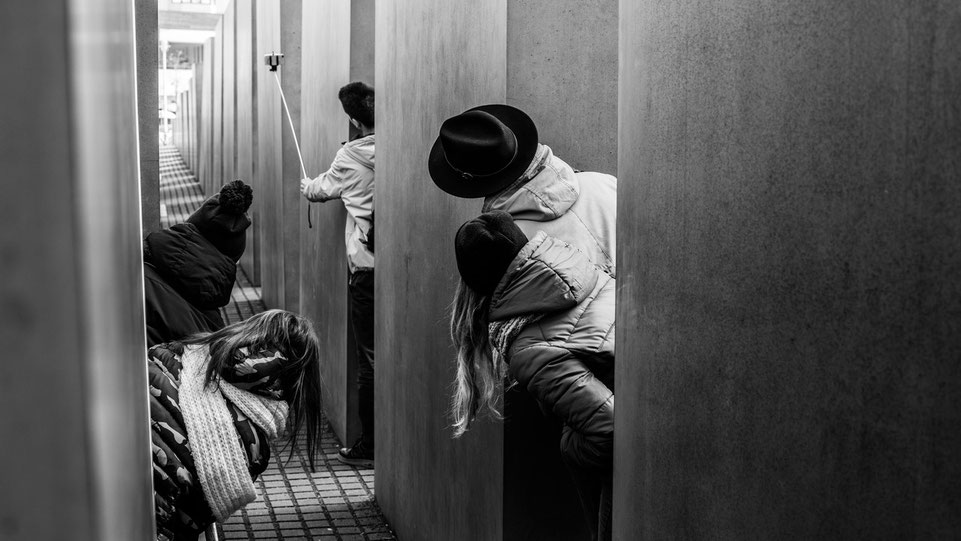 Youngsters taking a selfie at Holocaust Mahnmal in Berlin