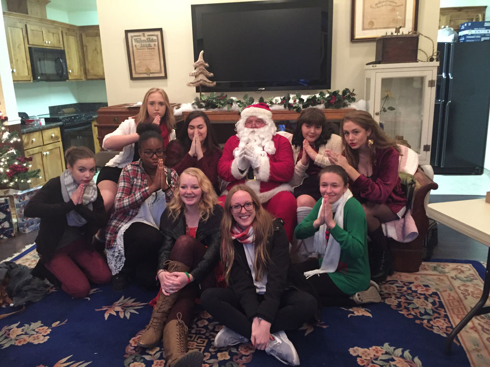 We were waiting to perform at the Stansbury House ... So part of the choir took a picture with Santa !