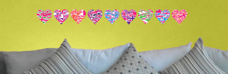 Mixed Magenta Pink Union Jack Uk heart stickers in a straight line pattern wall art from www.wallartcompany.co.uk