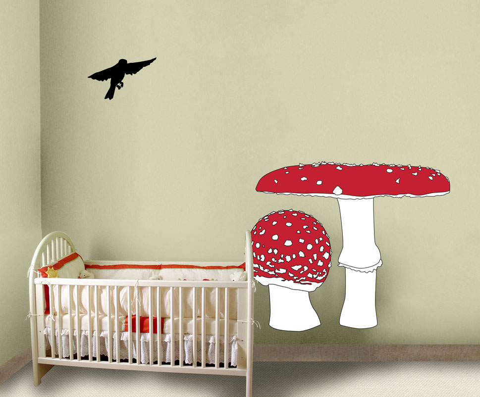 Vinyl wall art graphics that are printed and cut, using the colours red, white and black these mushrooms make a cute addition to any room. The room displaying the graphics is a cream colour in a nursery or children bedroom.