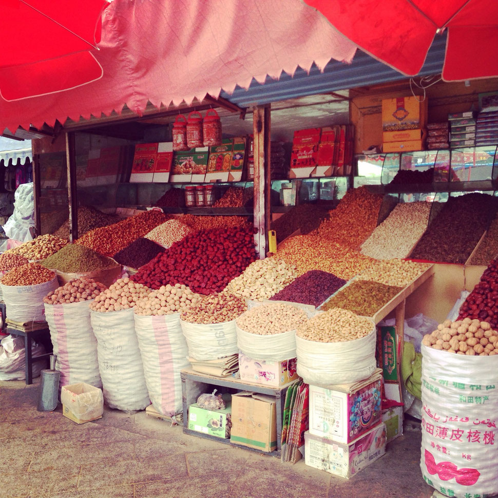 So many dry fruit are sold on a street.