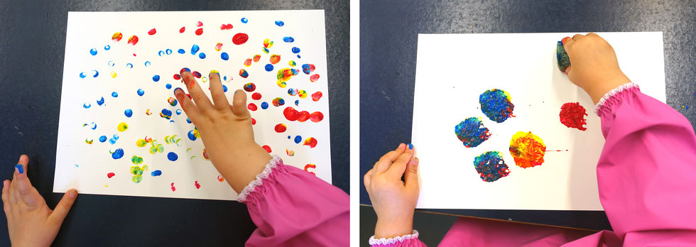 Kind malt mit Fingerkuppen und Schwämmen