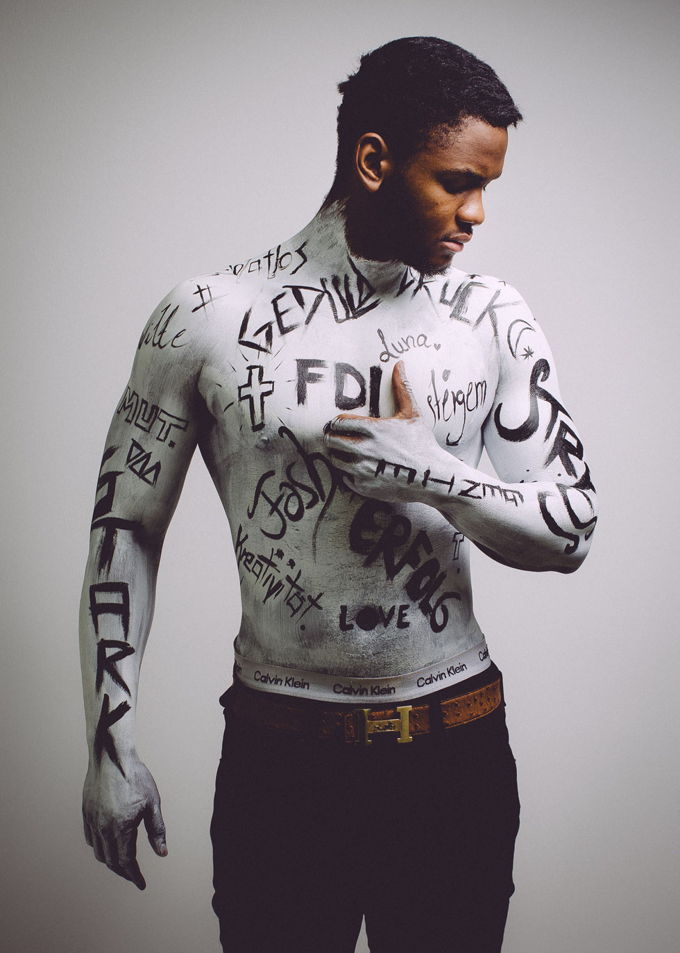 Who and what makes us? Emanuel's self-staging for his fashion project.