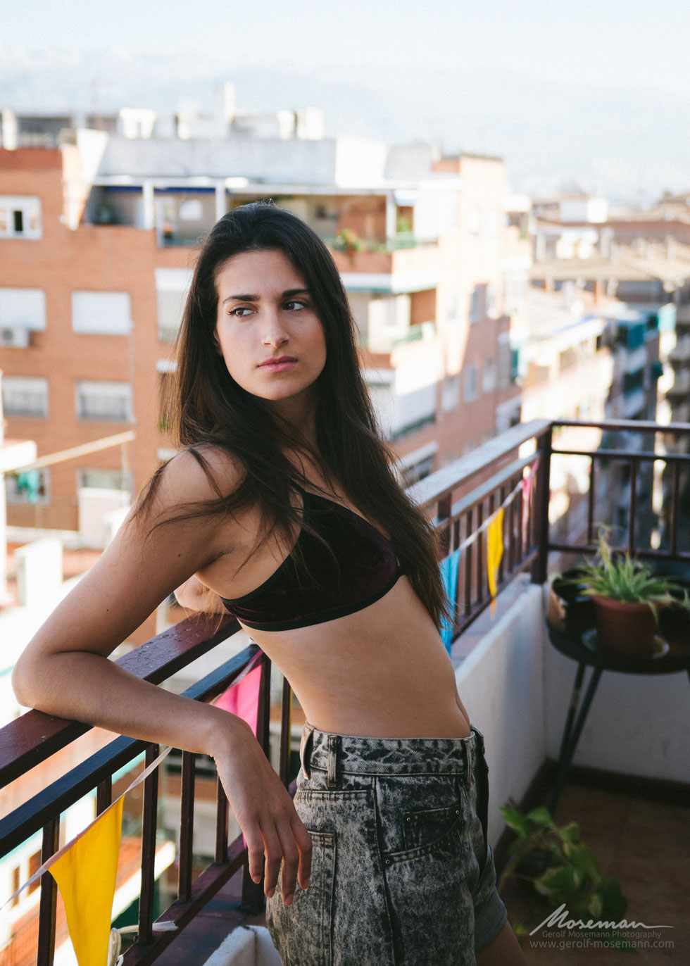 Mar on her balcony with city view in Granada