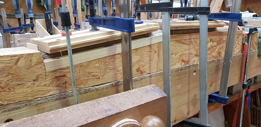 Bending the steamed legs of a Shaker Rocking chair.