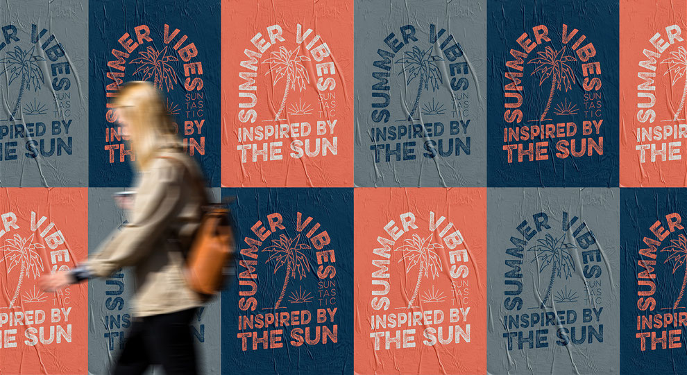 woman walking by a poster covered wall