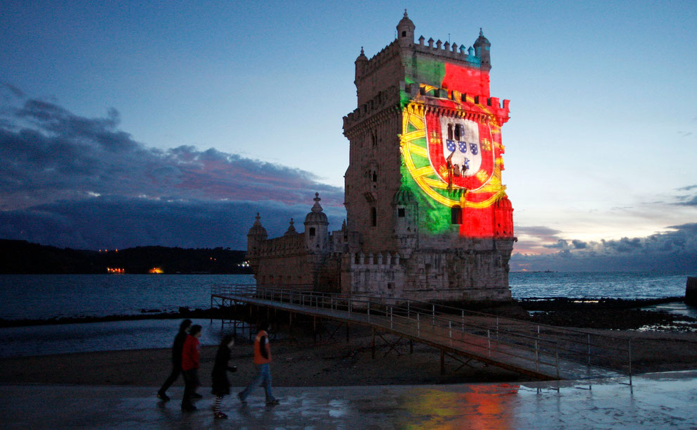 Belem tower with portuguese flag projected over in November 2009
