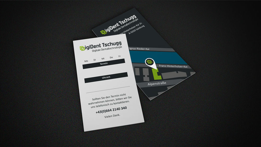 Terminvereinbarung auf einer Karte im Visitenkartenformat der Firma DigiDent Tschugg auf schwarzem Hintergrund