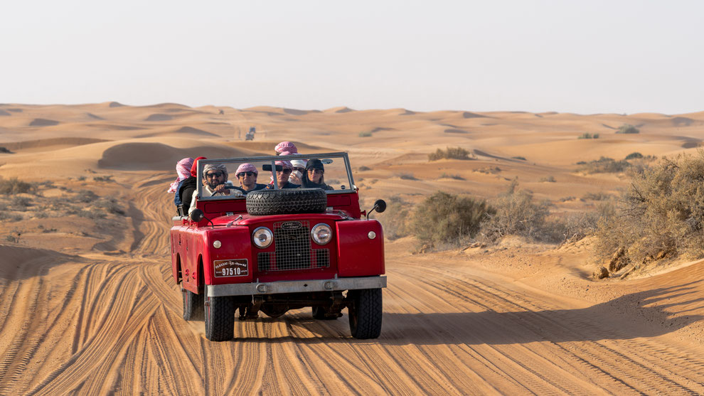 Red old Land Rover in desert