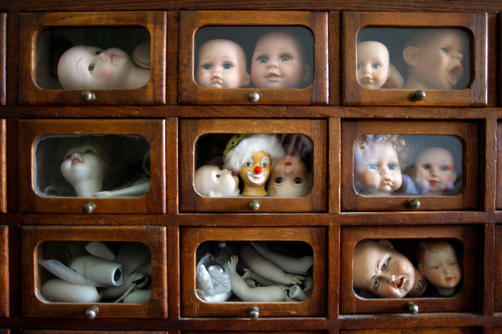 Dolls heads and body parts are displayed in drawers at the Doll Hospital in Lisbon December 17, 2009.