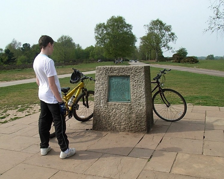 A young scout examines the Jamboree Stone which celebrates the 50th anniversary get-together here of the World Scouting Movement in 1957.