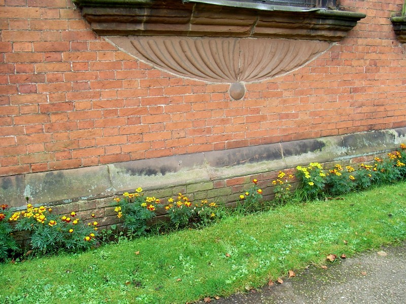 The footings of the chancel are of brick, the 18th century encasement.