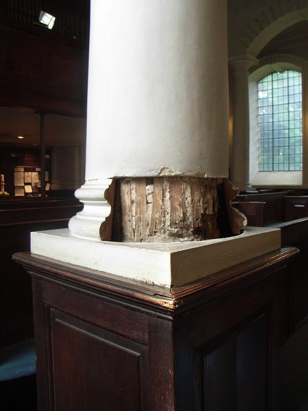 18th-century plasterwork removed to reveal medieval oak pillars.