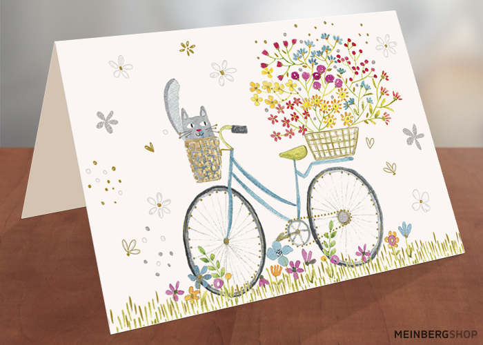 Fahrrad mit Katze und Blumen