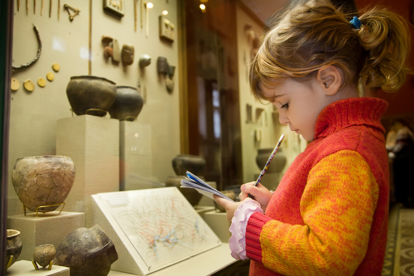 Young student using her creativity at the museum