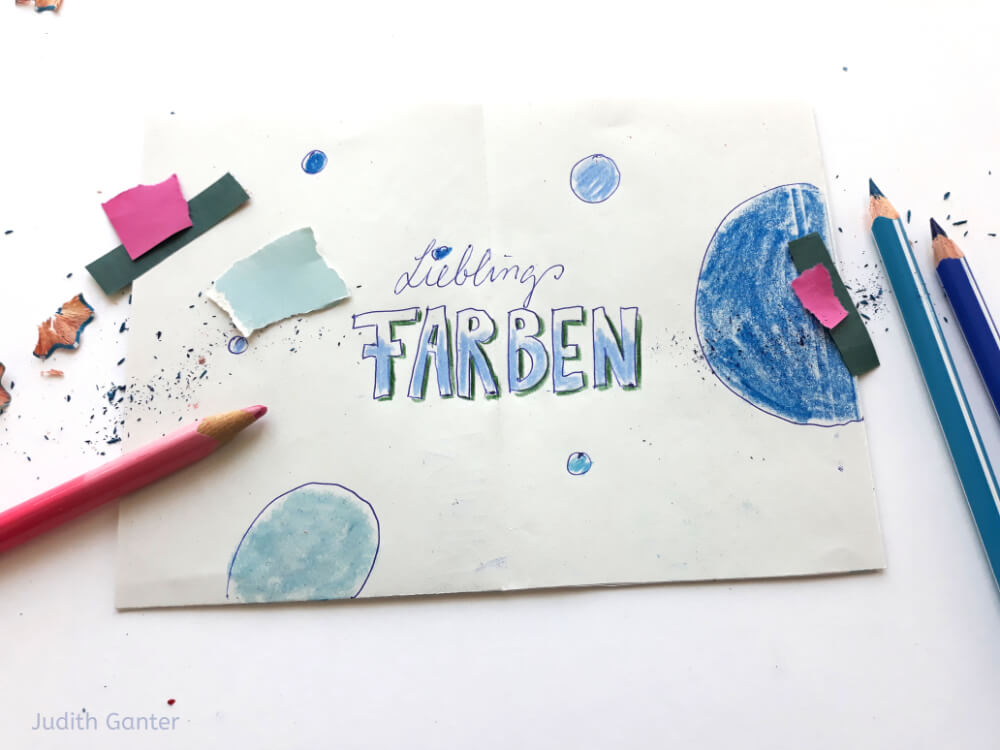 Titel: „Lieblingsfarben“ – Aufgeschlagenes Notizbuch mit Seifenblasen-Skizzen, daneben liegen Buntstifte.