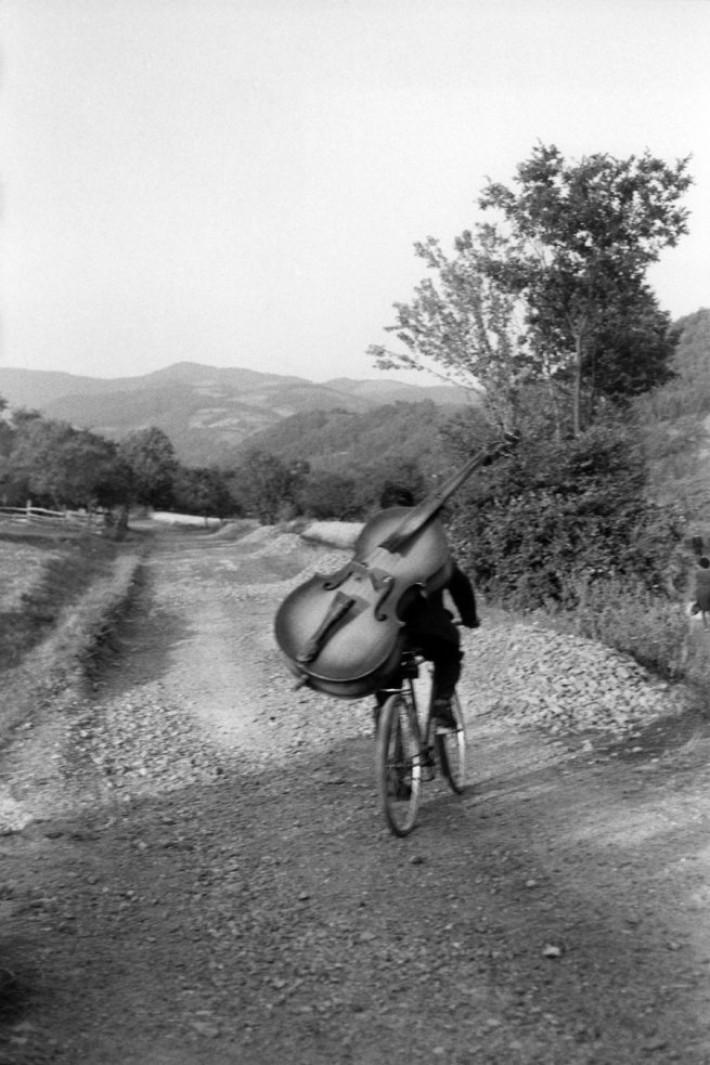 Henri Cartier-Bresson Serbia. Bass player on the road Belgrade-Kraljevo, to play at a village festival near Rudnick Yugoslavia 1965