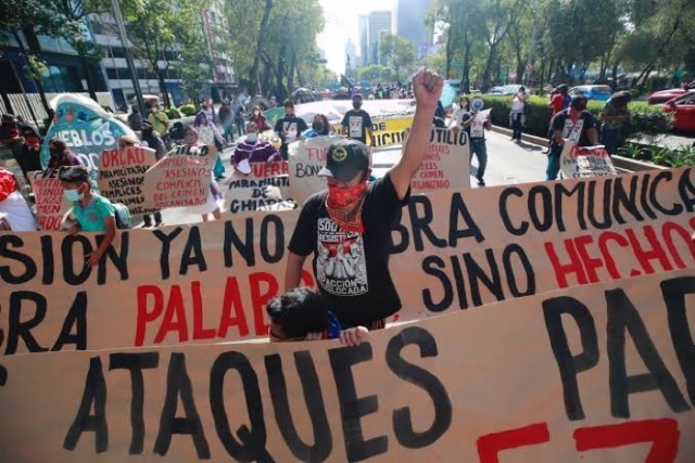 Demonstrators in Mexico City march against the violence against the Zapatista communities and the impunity that prevails for paramilitary groups like ORCAO.