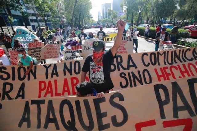 Demonstrators in Mexico City march against the violence against the Zapatista communities and the impunity that prevails for paramilitary groups like ORCAO. 