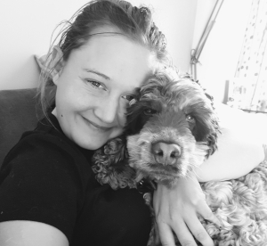 pet sitting service in your home by Sophie owner of K9 seen her cuddling a gorgeous springer spaniel takes care of your pets in your own home, member of Wheathampstead businesses Group