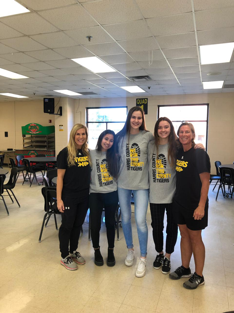 That was at the Cross Country Christmas Banquet. Maria, Sara and I took a picture with our coaches MJ and KB.