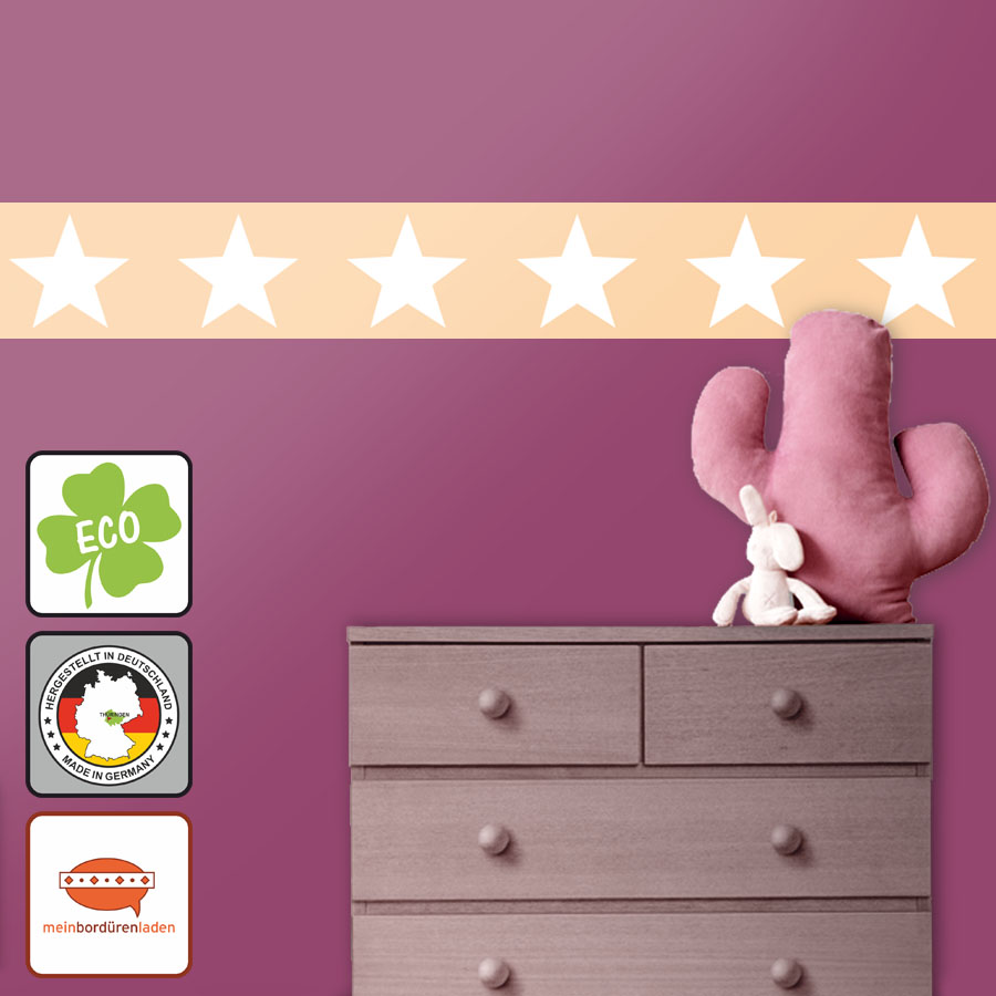 umweltfreundliche ECO Vlies Bordüre für Kinderzimmerdekoration mit großen weißen Sternen auf apricotfarbenem Hintergrund