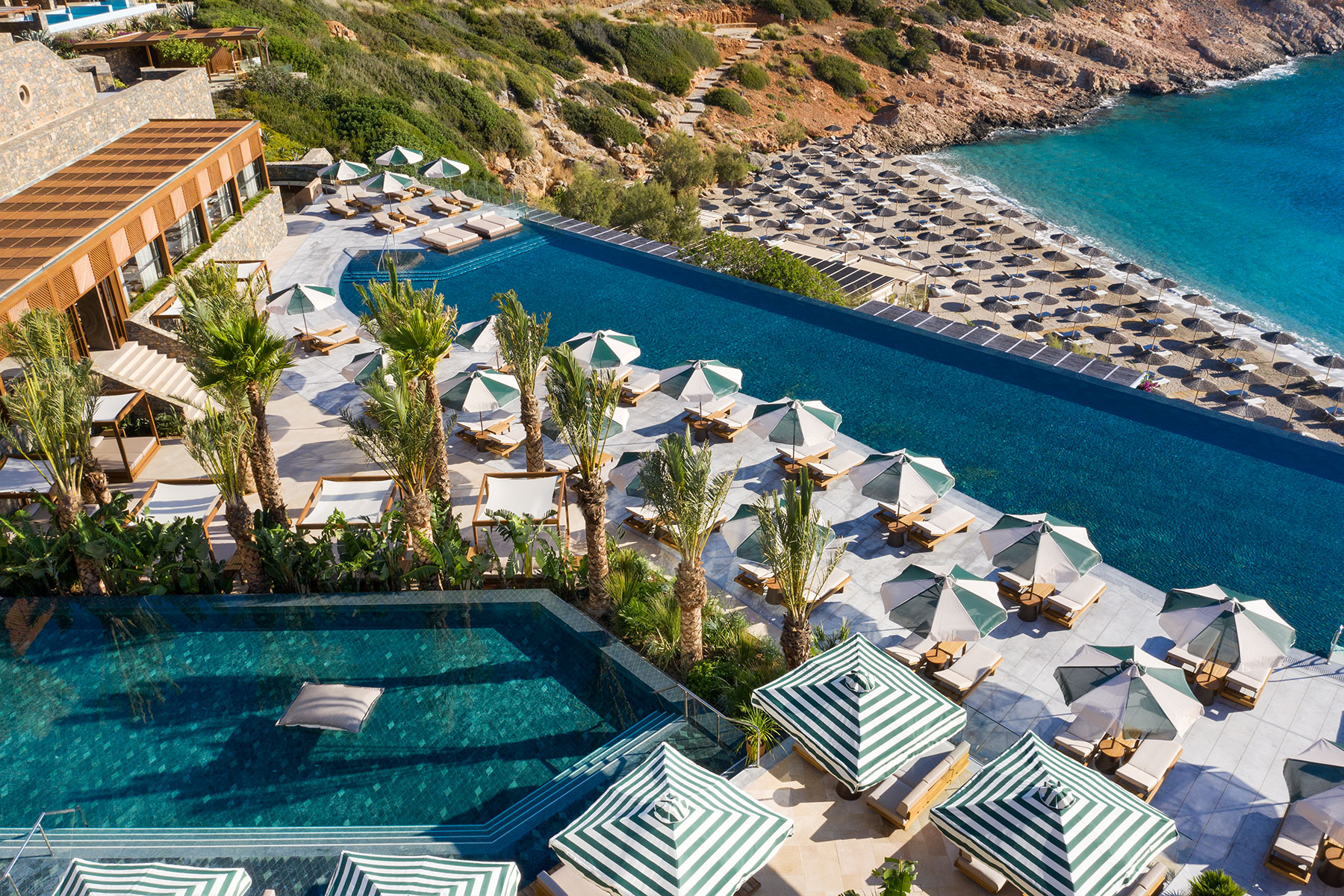 This Luxe Resort on the Largest Island in Greece Has a Stunning Private Beach — and Unreal Sea Views From Every Room